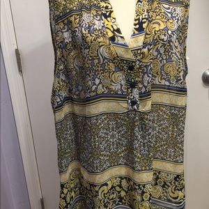 Cute floral blouse with cut out back.